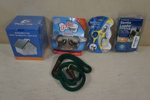 lot 109 image: Dog Products - Anti Bark Birdhouse, Slow Feeder, Clipper, Leashes
