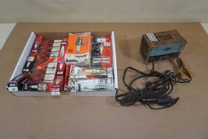 lot 233 image: Assorted Spark Plugs and Vintage Battery Charger