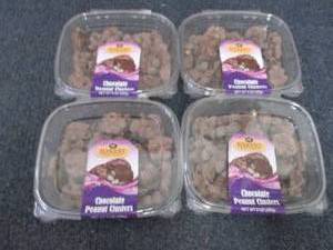 lot 19 image: 4- 9 oz Chocolate Peanut Clusters...