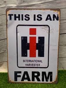 lot 115 image: INTERNATIONAL HARVESTER METAL SIGN 8 X 12 INCHES