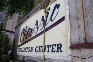 lot 620 image: Classic Collision Center Sign