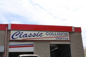 lot 621 image: Classic Collision Center Sign