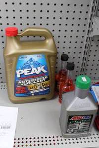 lot 647 image: Lot of (4) Automotive Supplies - AMS Oil, Peak Anti-freeze, (2) AMS Quick shots