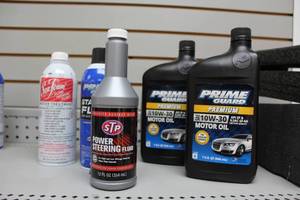 lot 657 image: Lot of (5) Automotive Supplies - (2) Prime Guard 10W-30 Motor Oil, STP Power Steering Fluid, Seafoam Engine Treatment, Prime Guard Starter Fluid