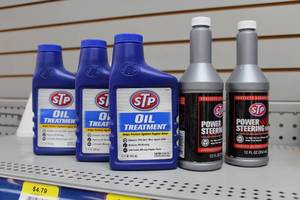 lot 659 image: Lot of (5) Automotive Supplies - STP Power Steering Fluid (x2), STP Oil Treatment (x3)