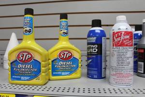 lot 658 image: Lot of (4) Automotive Supplies - STP Diesel Injector (x2), Seafoam, Prime Guard Starting Fluid