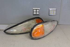 lot 754 image: Lot of (2) Pontiac Grand Am Headlight Assembly (Builders Quality)