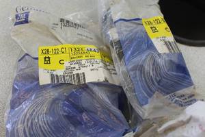 lot 825 image: Lot of (2) GM Left and Right Side Rear Bumper Supports (New In Package)