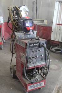 lot 1151 image: Rolling Mig Wire Feed Welder with Tank and (2) Masks
