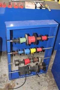 lot 372 image: Metal Wire Storage Rack w Spools of Wire