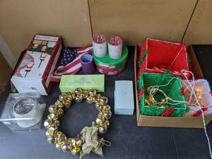 lot 110 image: Christmas Decor Bell Wreatch, Outdoor Presents, Santa Lawn Stakes, and More