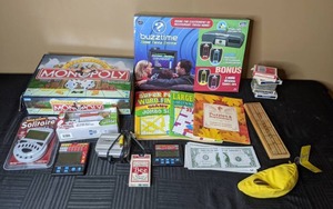 lot 247 image: Assortment of Games Monopoly, Buzztime Home Trivia System, Cribbage, Bananagrams, & More