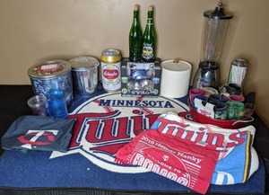 lot 253 image: MN Twins Party Lot Twins Collectibles, Beverage Coozies, Collection of Bottle Caps, Beverage Dispenser and More