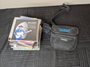 lot 230 image: Collection of Country CDs and Panasonic Portable CD Player (Kenny Chesney, LeAnn Rimes, Alan Jackson, Larry the Cable Guy, and more)