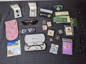 lot 232 image: (2) Eyeglasses, Sunglasses, (2) Colibri Electro-Quartz Lighters, Analog Sport Watch, Assortment of Commemorative Pins, and more