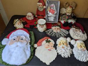 lot 196 image: An Assortment of Christmas Decor with 11 Different Varieties of Santas Galore that includes Dept. 56