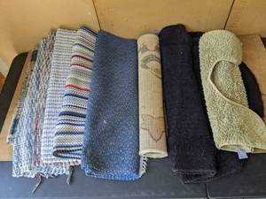 lot 202 image: Assortment of 9 Rugs Bathroom Rugs, Rag Rugs, Christmas Rug and More
