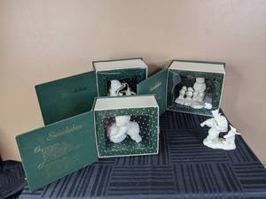 lot 157 image: (4) Department 56 Ceramic Figurines Winter Tales of the Snowbabies Collection - I Have Lots To Give, Fishing for Dreams, Ill Teach You a Trick, Im Making Snowballs