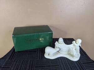 lot 28 image: Vintage Department 56 Snowbabies Polar Bear Merry Christmas Figurine, Signed