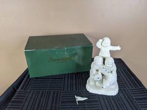 lot 26 image: Vintage Department 56 Snowbabies Playing on Polar Bears Figurine
