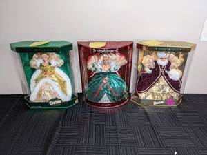 lot 291 image: Happy Holiday Special Edition Barbies from 1994, 1995, 1996