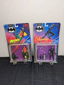 lot 272 image: Vintage Kenner Batman Returns Robin with Launching Grappling Hook and Cat Woman with Whipping Arm Action and Taser Gun Action Figures