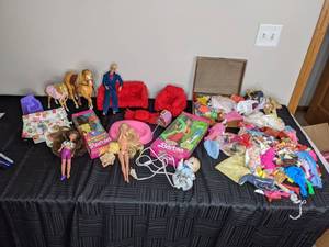 lot 277 image: Assortment of Barbie Clothes, Horses and Accessories
