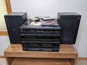 lot 257 image: Sharp FM Stereo Remote Control System, Sharp Integrated Stereo Amplifier, Sharp Stereo Cassette Deck, Sharp Bass-Reflex Speaker System with 50s and 60s Cassettes