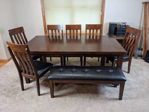 lot 3 image: Signature Design by Ashley Rectangular Butterfly Extension Table, (6) Chairs and Bench