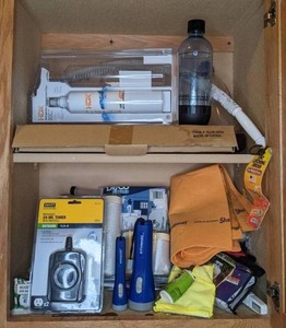 lot 190 image: Assortment of Handy Household Items, Many New Outdoor Timer, Polaroid Flashlights, ShamWow, Fiba Tape, Soda Stream Bottle, HDX Refrigerator Replacement Filter and More