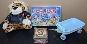 lot 343 image: ToysGames Biker Tiger Plush, Disney Edition Monopoly, New 64 Crayola Crayon Tin, Toy Wagon