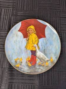 lot 309 image: The World of Children by John McClelland Rainy Day Fun First Issue Limited Edition 376110,000 Decorative Plate