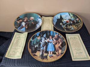 lot 313 image: The Great and Powerful Oz 1767E, Were Off to See the Wizard 1570O and The Witch Casts a Spell 2406F From The Wizard of Oz Commemorative Plate Collection By The Hamilton Collection