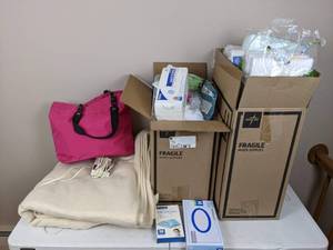 lot 57 image: Assortment of Supplies Bed Pads, Diaper Bag, Heating Pad, Wipes, Face Masks, Gauze Sponges and Other Medical Supplies