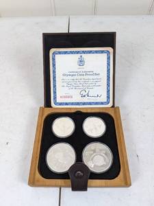 lot 19 image: Vintage Royal Canadian Mint 1976 Olympic Coin Set of (4), 10 Dollar & 5 Dollar