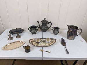 lot 27 image: Assortment of Mixed Silver Plated and Sterling Tea Pot, Cups, Candle Stick holders, Pitcher and More by  F.B. Rogers Silver Co., Rogers & Bro, Quadruple Plate and More
