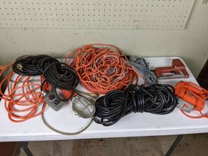 lot 113 image: Black & Decker Two Speed Electric Jig Saw, Swingline Electric Staple Gun, a Work Light, and Various Extension Cords
