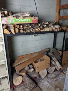 lot 118 image: Large Assortment of Wood Logs with a Stand