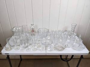 lot 97 image: Large Assortment of Clear Glass Bowls, Cups, Bottles, Vases and More