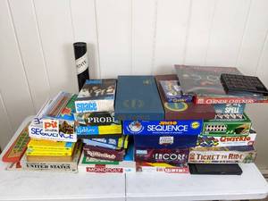 lot 14 image: Assortment of Board Games and Games Sequence, Monopoly, Ticket to Ride, Chinese Checkers, Yahtzee, Cribbage, Scrabble, Probe, Hoot Nanny and More