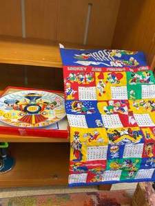 lot 180 image: Mickey Mouse Birthday Plate and Disney Fabric Calendar