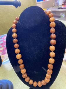 lot 712 image: Chunky Wood Bead Necklace and WWJD Hemp Necklace