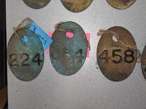 lot 479 image: Vintage Brass Cow Tags