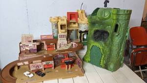 lot 57 image: 3 Vintage Castles for The Prince - Hot Wheels City Race Track - MOTU Castle Grayskull - Fisher Price Castle