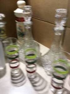 3 decanters glass and Seagrams decanter and 6 glasses.
