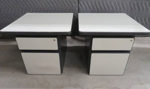 2 SMALL METAL FILE CABINENTS WITH LAMINATE TOPS.