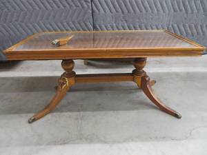 SMALL GLASS TOPPED COFFEE TABLE.