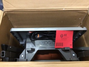 lot 44 image: Ridgid 7 In Table Top Wet Tile Saw With Stand - Open Box - Review all pictures