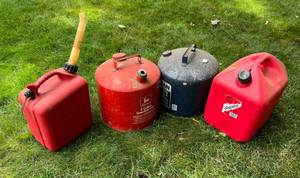 Four Gas Cans Two Metal And Two Plastic s