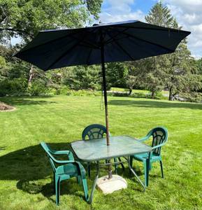 Metal And Glass Table With Unbrella (Umbrella Needs Repair) And Three Plastic Chairs ud
